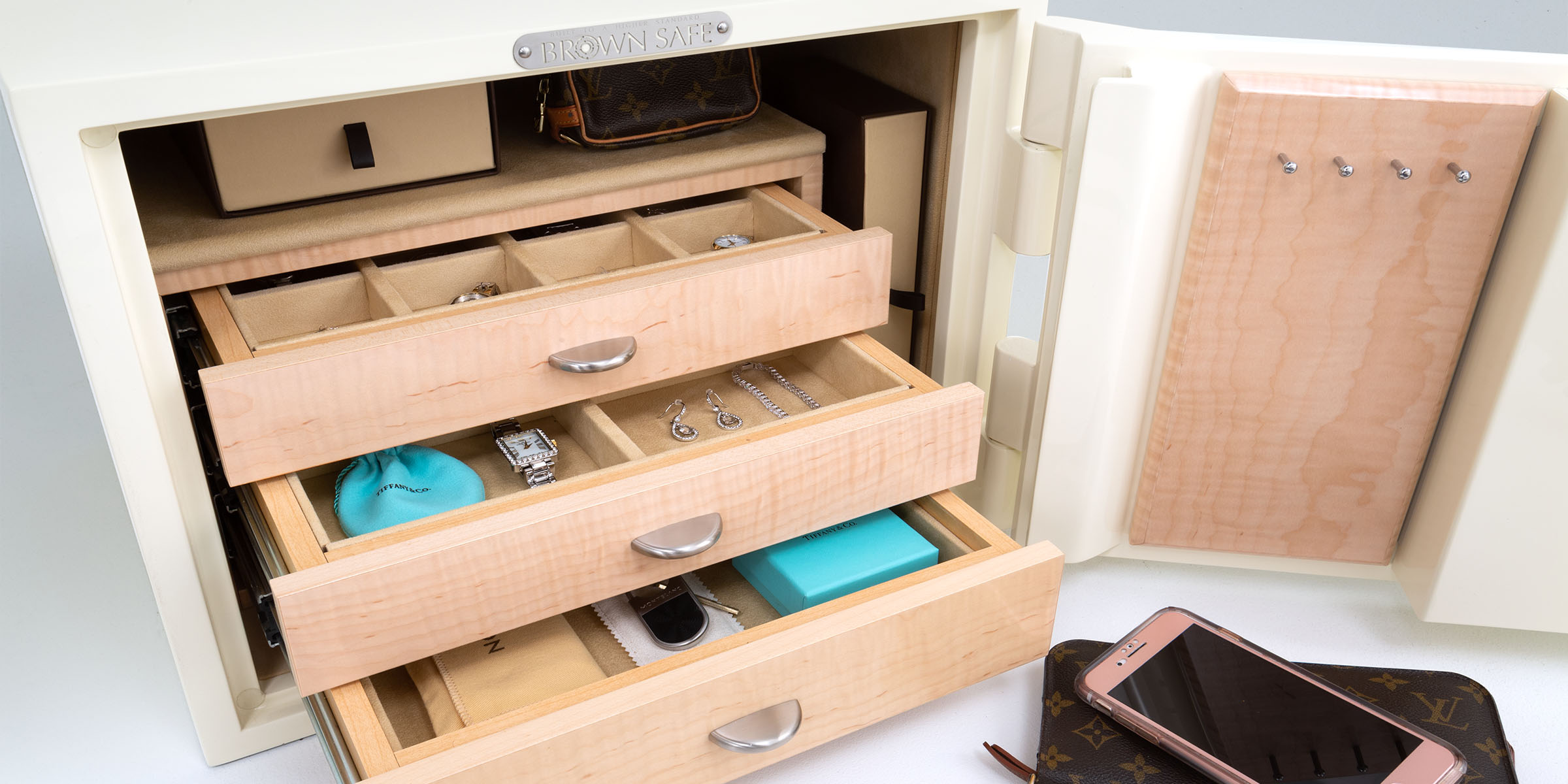 Decorative image of mini gem model with gloss white paint and maple jewelry chest