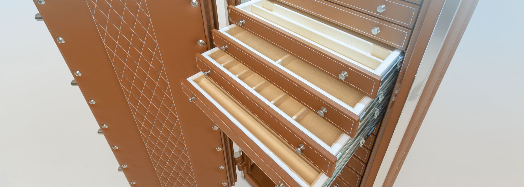 Interior of leather safe with drawers lined in ultrasuede for jewelry