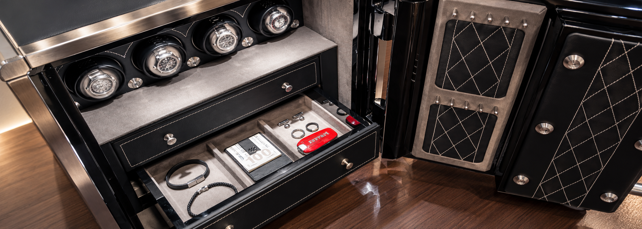 Small jewelry safe with leather exterior designed to protect and store watches and jewelry
